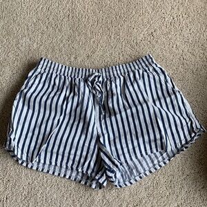 Blue and white striped cotton Universal thread shorts with pockets on side, back